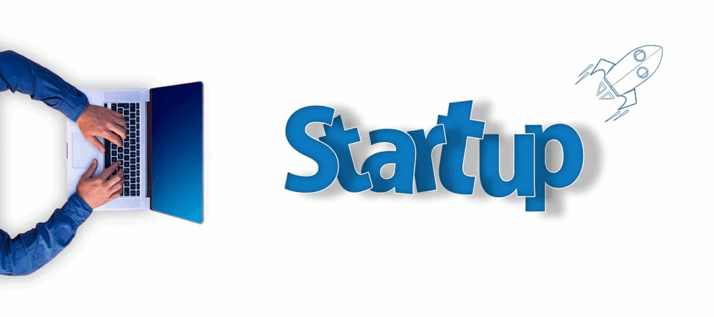 Laptop with startup text and rocket icon, symbolizing launching an affiliate business.